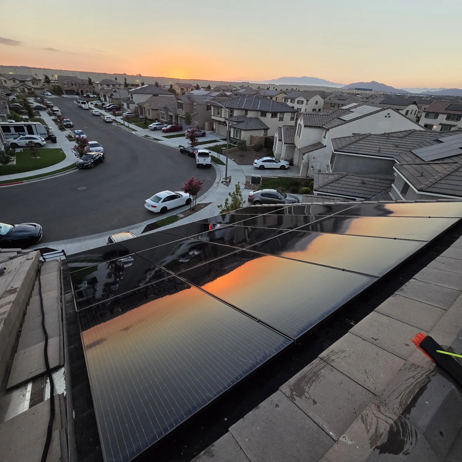 Clean solar panels reflecting a Moreno Valley sunset